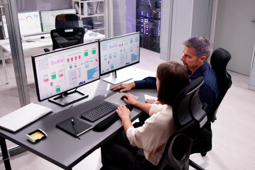 Two People Engaging in Computer Engineering