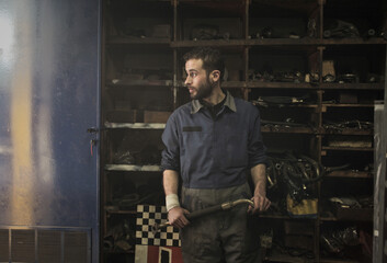 young mechanic in his workshop