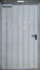 Weathered Iron Door: Aged Industrial Warehouse