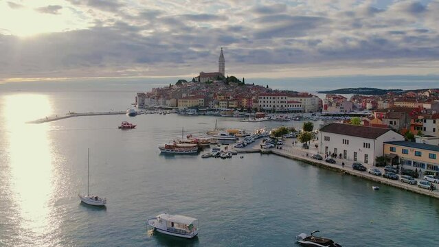 Sunset aerial drone panorama of old town Rovinj, famous ancient Croatian city at the sea. Istria, Croatia.