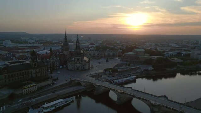 Spectacular aerial view flight drone. Sunset town Dresden Cathedral Bridge River