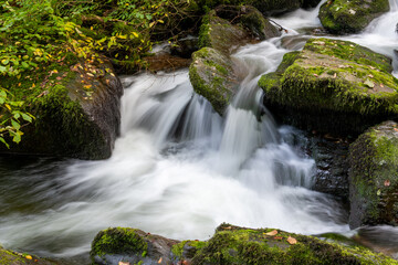 Long exposure of a waterfall on the Hoar Oak Water river at Watersmeet in Exmoor National Park