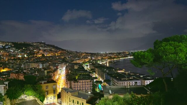 Zoom out shot of evening Naples, Italy. View from Belvedere di Sant'Antonio a Posillipo in night Naples