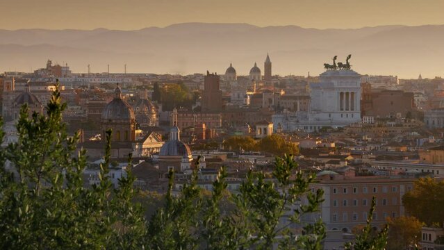 Beautiful Rome in morning lights of sun. Panning shot from Belvedere del Gianicolo. Churches and old town of Rome at sunrise, Italy