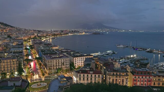 Panning HDR shot off night Naples, Italy. Old part of Naples city with embankment and views of Vesuvius