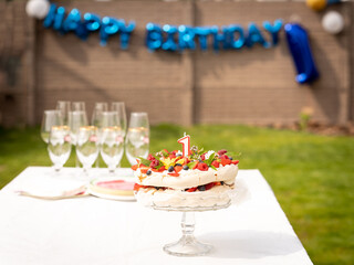 1 first birthday cake pavlova with fresh fruit berries flower candle