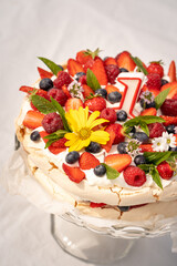 1 first birthday cake pavlova with fresh fruit berries flower candle
