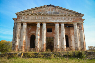 Fototapeta premium old architecture, ruins, Greek style, columns with the Doric order, triglyphic metope frieze, portico with pediment, entrance lobby, abandoned building