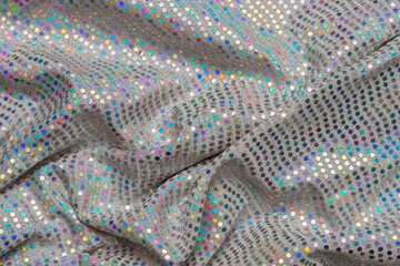 Wavy fragment of an elegant sequined party dress
