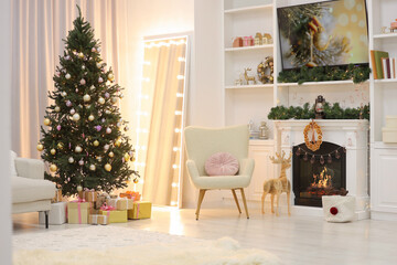 Beautiful Christmas tree and fireplace in living room