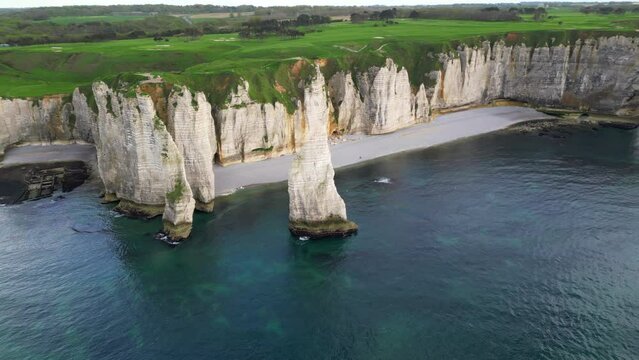 Aerial 4k drone view of Etretat. L'Aiguille, The Needle, Famous Alabaster chalk seacoast, Porte Aval cliffs, Natural Rock Arch Of &Eacute;tretat, Normandy, France, Atlantic Ocean, French holidays, landscape
