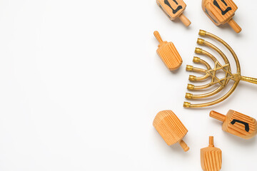 Hanukkah composition with menorah and dreidels on white background