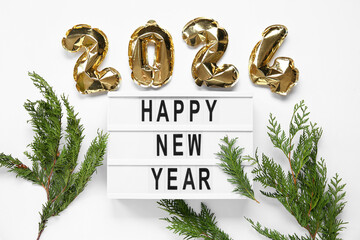 Board with text HAPPY NEW YEAR , figure 2024 made of foil balloons and thuja branches on white...