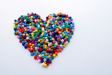 Heart made up of many colored beads used to make necklaces and bracelets