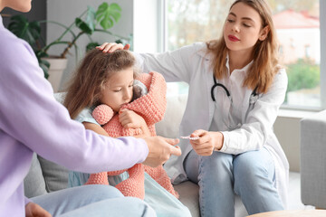 Ill little girl with her mother and doctor at home