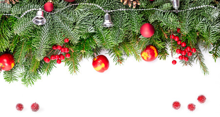 Christmas decorative background border with red bauble decorations, holly berries, spruce and pine...