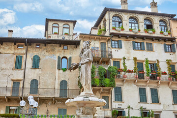 View of the beautiful Piazza delle Erbe with fountain in Verona, Province of Veneto, Italy.