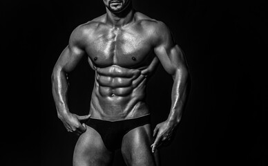 Fototapeta premium Muscular Torso. Sexy Man. Strong Muscle. Athletic Gay Posing Naked. Nude guy. Man showing muscular sixpack abs. six pack abs muscle. Fit male belly. Strong and Power Six pack Abs.