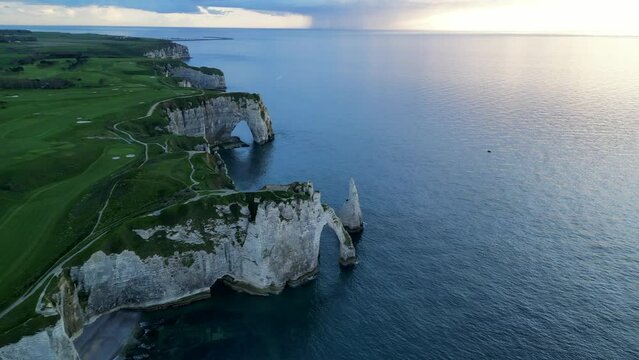 Etretat, Normandy, France, Atlantic Ocean, French holidays, landscape. Aerial 4k drone view of L'Aiguille, The Needle, Famous Alabaster chalk seacoast, Porte Aval cliffs, Natural Rock Arch Of &Eacute;tretat