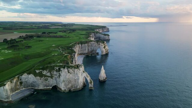 Etretat, Normandy, France, Atlantic Ocean, French holidays, landscape. Aerial 4k drone view of L'Aiguille, The Needle, Famous Alabaster chalk seacoast, Porte Aval cliffs, Natural Rock Arch Of &Eacute;tretat
