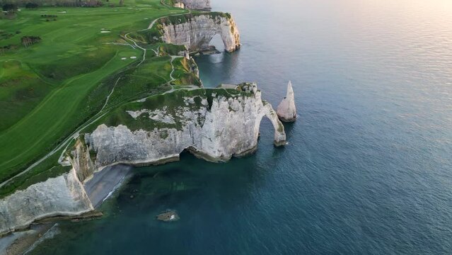 Etretat, Normandy, France, Atlantic Ocean, French holidays, landscape. Aerial 4k drone view of L'Aiguille, The Needle, Famous Alabaster chalk seacoast, Porte Aval cliffs, Natural Rock Arch Of &Eacute;tretat