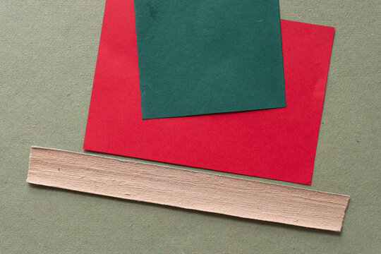 background composed of red card green tile and bookbinding spine stiffener or stripe on rough green paper