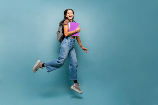 Attractive young woman having fun going to college