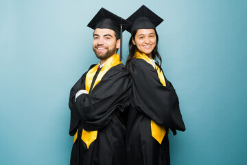 Hispanic attractive couple during their university graduation
