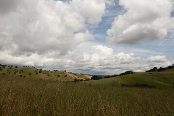 The Lagoon Valley Park in Vacaville, California, USA, offers a sweeping view of the rolling mountains of the city, on a partly cloudy day with sky copy space - 684021257
