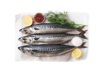 Tasty salted mackerels, spices and cut lemons on white background, top view