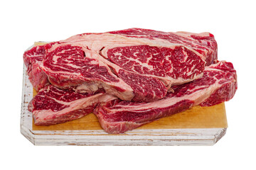Two pieces of beef steak on a white wooden board. Meat for cooking steaks.