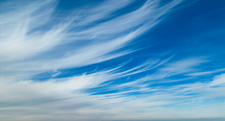 Wispy clouds in a blue sky
