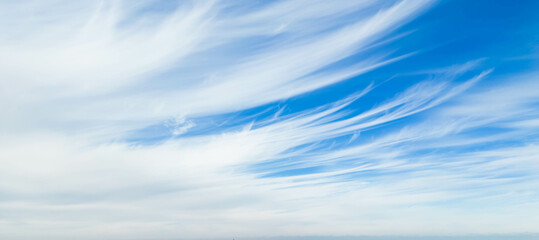 Wispy clouds in a blue sky
