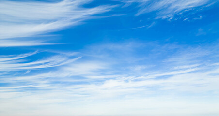 Wispy clouds in a blue sky