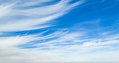 Poofy Clouds in a blue sky