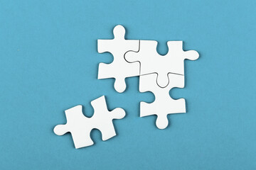 Puzzle pieces on color background, top view, close up