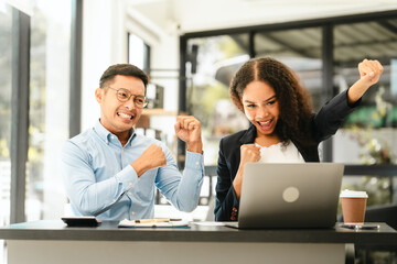 Asian business man and African American woman engaging in business discussion, possibly about merger or joint venture. two companies become one, one of companies often survives while other disappears
