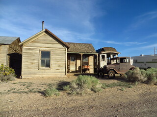 Fototapeta na wymiar Abandoned Americana, Goldfield, Nevada, Old Wooden House, Train, Car