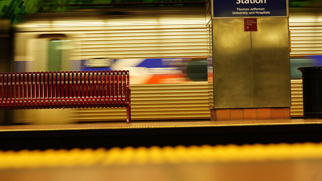 The railroad view with the parallel iron tracks and platform as background