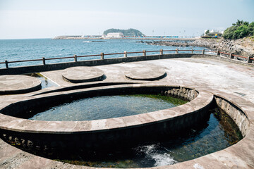 Seogwipo Sonammeori public bath spring water in front of sea in Jeju Island, Korea