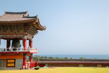 Yakcheonsa Temple and sea view in Jeju Island, Korea