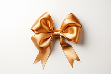 Gold ribbons tied in a bow on white background