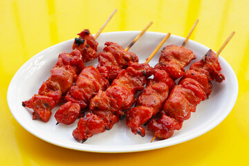 Thai-style grilled chicken. Thai chicken skewers street food