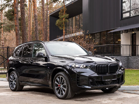 Novosibirsk, Russia -  November 16  , 2023:       Black BMW X5, SUV parked in city ,   front view