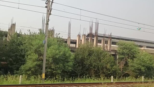 New Delhi India - October 09 2023 &ndash; View from inside Delhi metro station, Delhi Metro inside view during day time, Delhi Metro Train Crossing New Delhi, India, Asia, Public Metro departing