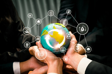 Business partnership holding Earth globe together with eco sustainability icon symbolize ESG...