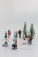 Miniature People , Families are joyfully celebrating and dining together.  Concept of a Merry Christmas