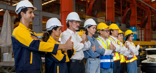 Confident and smiling lineup of factory worker, engineer, manager and foreman stand on-site within...