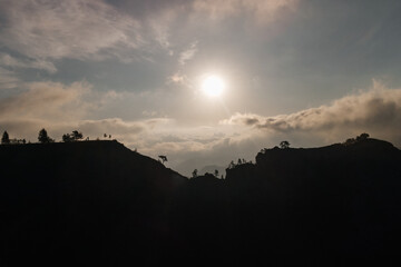 sunrise among the clouds over the mountains