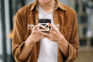 Man hands using Laptop, tablet typing on keyboard and surfing the internet with email icon, email marketing concept